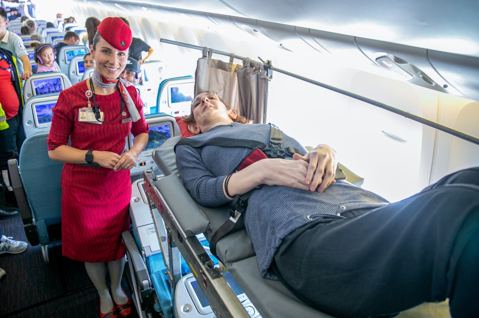 First  Flight  of  the tallest woman in the World ! Turkish Airlines  made  it  by  removing  Six  seats  to make room for her travel to  San Francisco .
